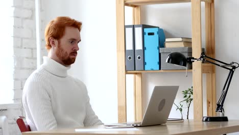 Sleeping-Creative-Man-with-Red-Hairs-in-His-Office