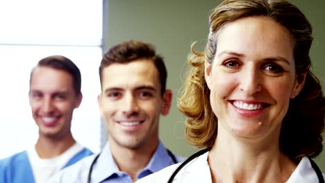 Portrait-of-doctors-and-nurse-standing-in-hospital