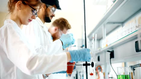 Young-students-of-chemistry-working-in-laboratory