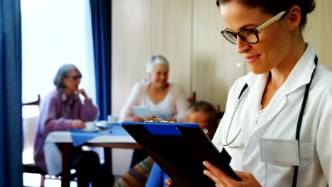 Portrait-of-female-doctor-reading-reports-4k