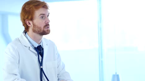 Doctor-Sitting-in-Clinic-with-Stethoscope-in-Ears