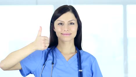 Portrait-of-Thumbs-Up-by-Doctor-in-Clinic