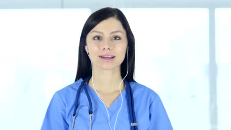 Portrait-of-Smiling-Positive-Doctor-in-Clinic