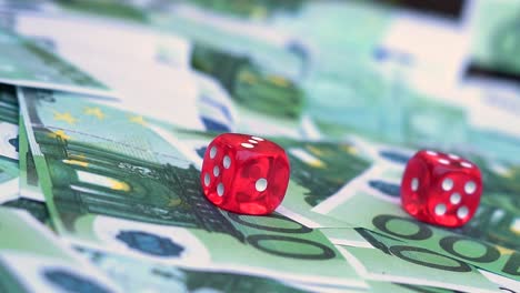 Red-dice-falling-on-100-euro-money-bill