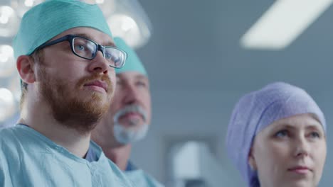 Diverse-Team-of-Professional-surgeon,-Assistants-and-Nurses-Standing-Proudly-in-the-Real-Modern-Hospital-with-Authentic-Equipment.