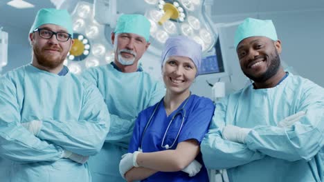 Diverse-Team-of-Professional-surgeon,-Assistants-and-Nurses-Standing-Proudly-with-Crossed-Arms-in-the-Real-Modern-Hospital-with-Authentic-Equipment.