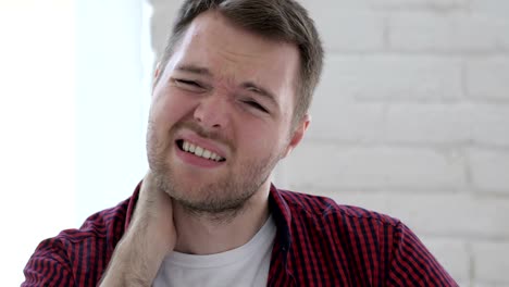 Tired-Young-Man-Trying-to-Relax-Body-by-Stretching