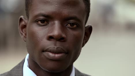 Serious-and-proud-black-african-business-man-staring-at-camera--outdoor