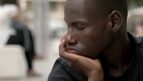 focus-on-Thoughtful-young-black-african-man.-Thoughts,worries--outdoor