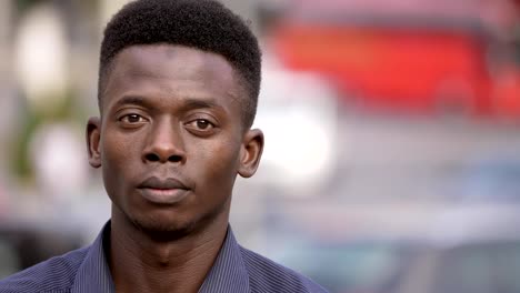 Proud-handsome-black-african-young-man-looking-at-camera-in-the-street