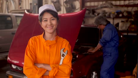 Portrait-of-a-young-beautiful-car-mechanic-in-a-car-workshop,-in-the-background-of-service.-car-service-concept.-dolly-shot