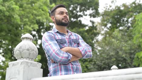 Portrait-Of-Young-Handsome-Indian-Man-In-Park