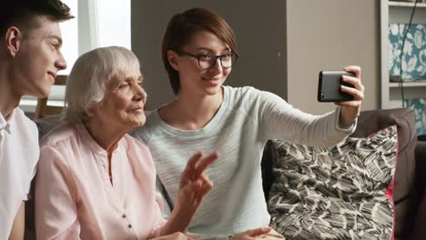 Woman-Posing-for-Selfie-with-Two-Grandchildren