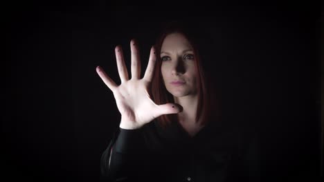 4K-Portrait-of-a-Woman-Gesturing-with-Hand-on-Invisible-Button