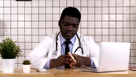 African-American-Doctor-Making-Notes