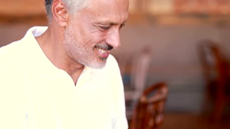 Happy-man-using-his-laptop-computer