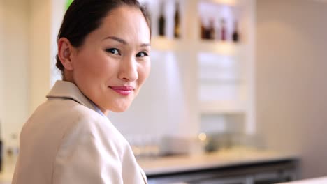 Asian-businesswoman-smiling-at-camera