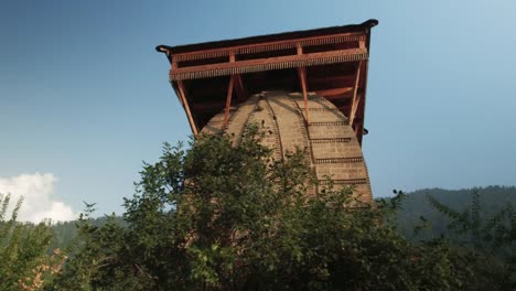 An-unknown-Hindu-forest-temple-in-the-mountains,-Himachal-Pradesh,-Kullu-Valley