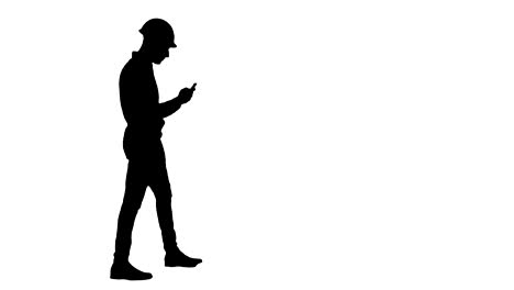 Silhouette-Civil-engineer-in-helmet-using-mobile-phone