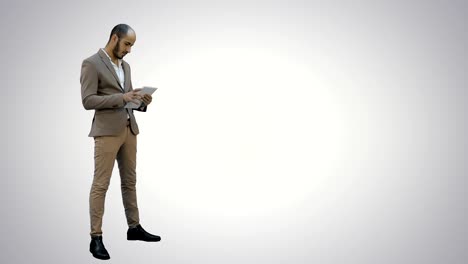 Young-businessman-using-digital-tablet-on-white-background