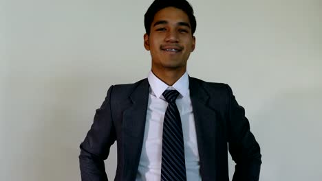 business,-people,-success,-happiness-and-cheerful-concept---smiling-young-man-startup-entrepreneur-businessman-wearing-gray-suit-with-white-background