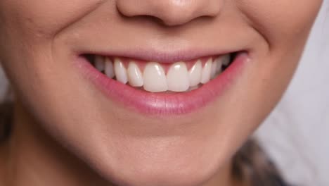 Extreme-closeup-of-woung-woman's-mouth-smiling