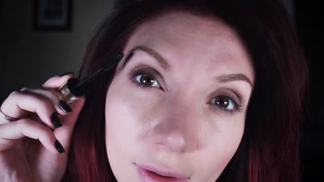 4K-Woman-Applying-Mascara-on-Eyelashes-In-Mirror