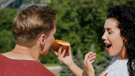 Portrait-of-cute-in-love-couple-have-fun-and-eats-pizza