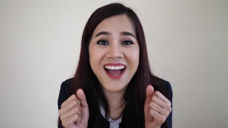 Happy-cheerful-business-woman-looking-at-camera-with-joyful-and-charming-smile.