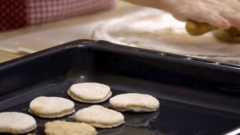 Woman-rolls-dough-with-a-rolling-pin