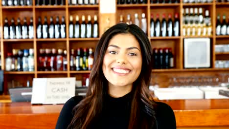 Beautiful-waitress-standing-with-arms-crossed-in-bar-4k