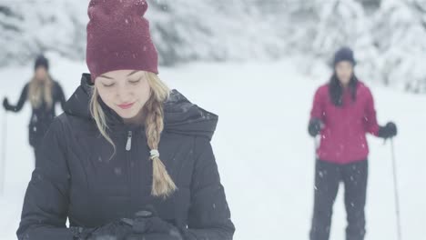 Portrait-shot-of-a-beautiful-young-Asian-woman-smiling-on-a-snowy-day