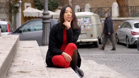 Tthoughtful-lonely-asian-woman-sitting-on-the-step