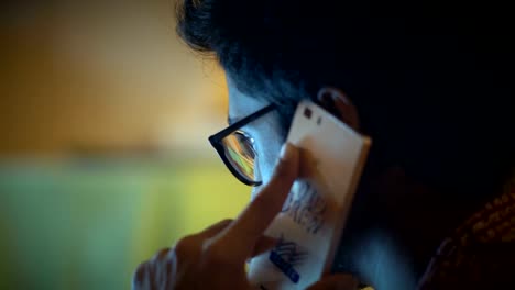 Close-up,-Indian-Man-In-Glasses-Speaks-On-Phone,-Discusses-Business-Questions