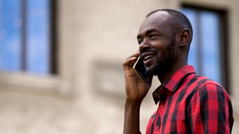 man-talking-by-smartphone-in-the-street