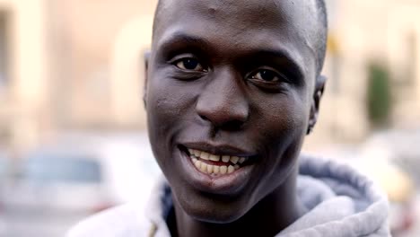 Happy-smiling-black-african-man-looking-at-camera--outdoor