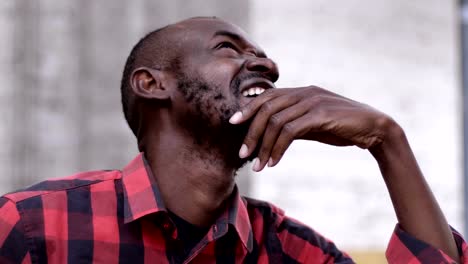 Worried-and-pensive-black-man-looking-up--outdoor