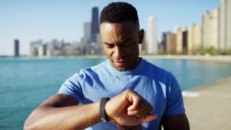 Portrait-of-Ethnic-male-resting-checking-pulse-rate