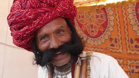 Angry-man-from-Rajasthan-with-big-moustache-calling-out-someone-in-anger-and-raising-hands