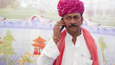 Handheld-phone-rings-and-an-Indian-man-having-a-serious-conversation