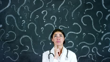 The-portrait-of-the-professor,-the-doctor-(student)-stands-at-the-black-board,-on-a-black-background.