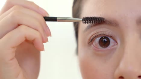 female-applying-brow-gel-for-eyebrows.