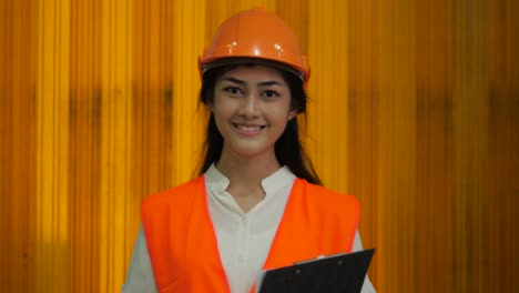 Portrait-of-happy-and-cheerful-woman-engineer-looking-at-the-camera-in-beverages-manufacturing-industry