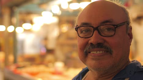 Portrait-of-a-hispanic-butcher-smiling-at-the-camera