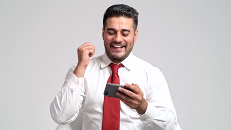 Businessman-playing-mobile-phone-games-during-office-hour.