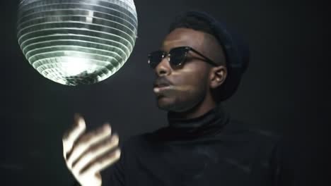 Male-Rapper-Spinning-Disco-Ball-and-Smoking