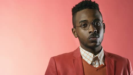 Stylish-Man-Posing-against-Pink-Background