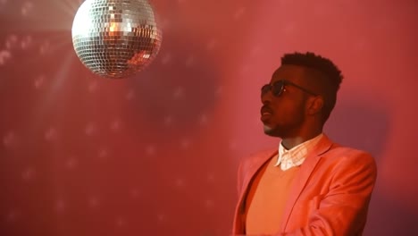 Black-Man-Spinning-Disco-Ball-and-Partying