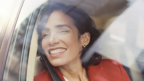 Beautiful-Happy-Woman-Rides-on-a-Passenger-Seat-of-a-Car,-Looks-in-Wonder-at-Big-City-View.-Camera-Mounted-outside-Moving-Car.