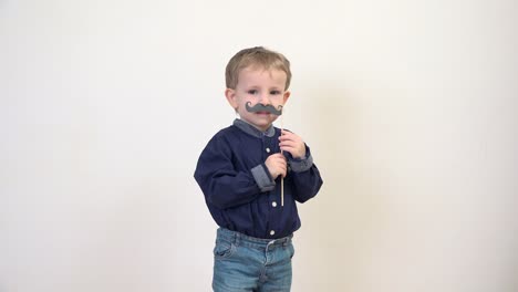 Handsome-little-man-with-awn,-cute-little-boy-playing,-mustache-shape-mask-carnival